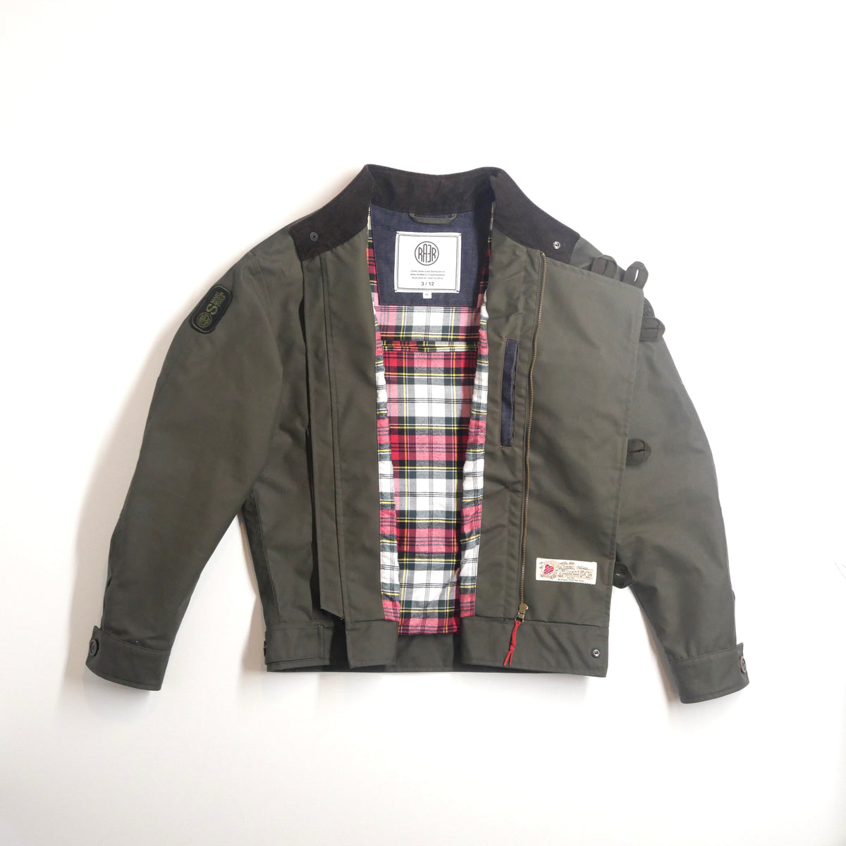 Veste ASCONA 2 WX kaki ouverte à plat, montrant sa doublure à carreaux.