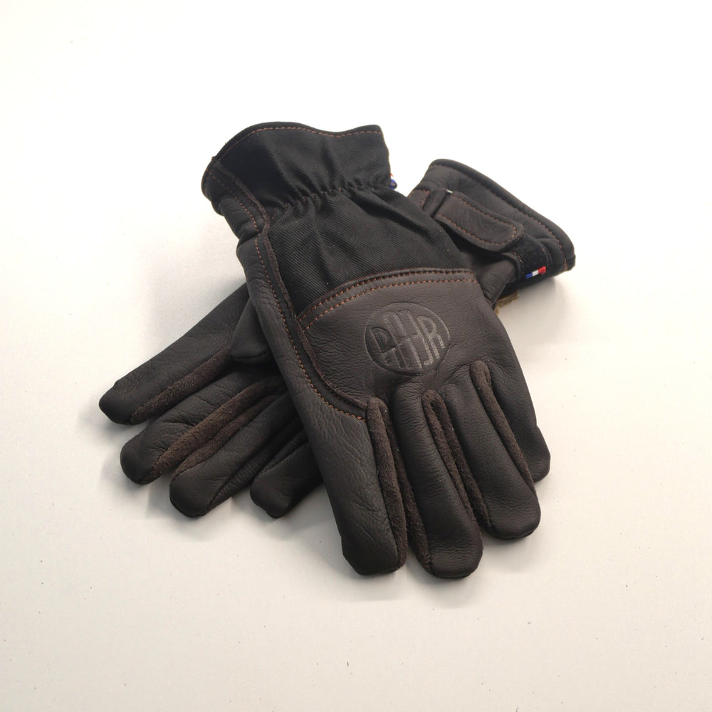 Paire de gants ALASKA noir en cuir et Armalith, posés l’un sur l’autre.