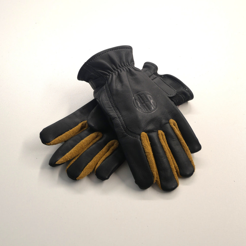 Paire de gants APPLE 2 noirs posée sur fond clair, avec empiècements contrastants entre les doigts.