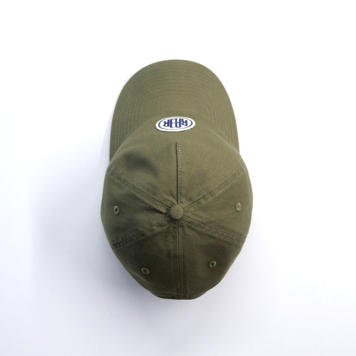 Casquette ORIGINAL kaki vue du dessus, montrant le bouton, les coutures et la visière.