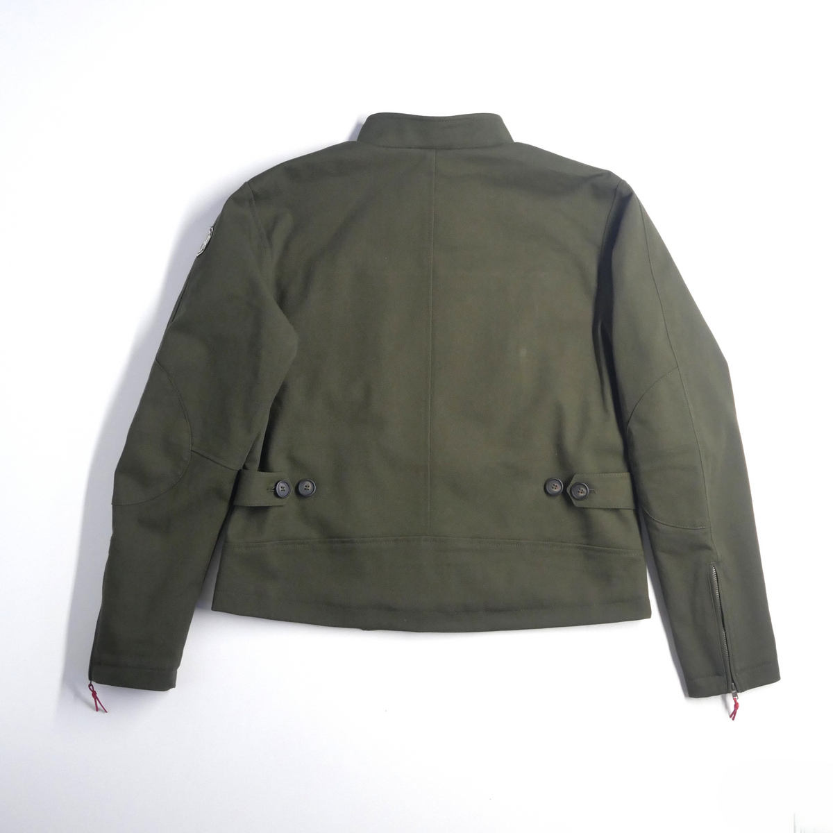 Veste DONNA Armalith kaki posée à plat, vue de dos avec les réglages à la taille.