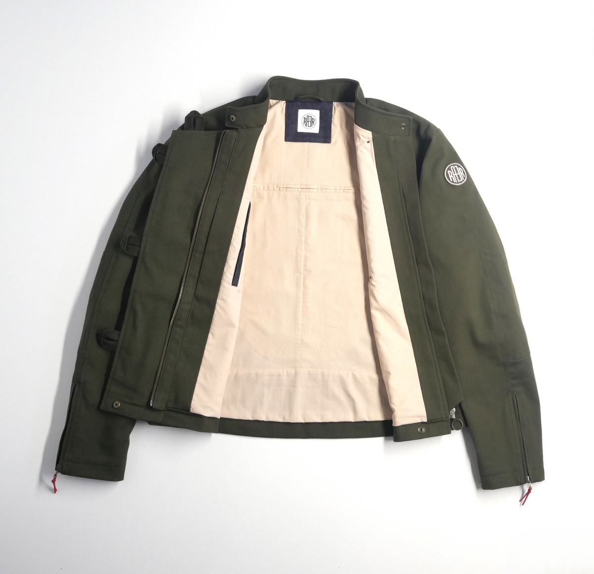 Veste DONNA Armalith kaki ouverte à plat, avec sa doublure claire visible.